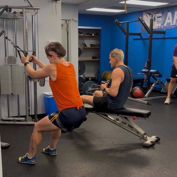 Aaron coaching a one-on-one personal training session at A-Game